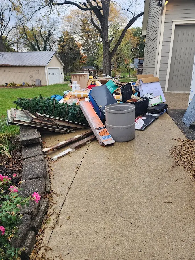 Dumpster being loaded with debris for 30 Yard Dumpster Rental in Evansville